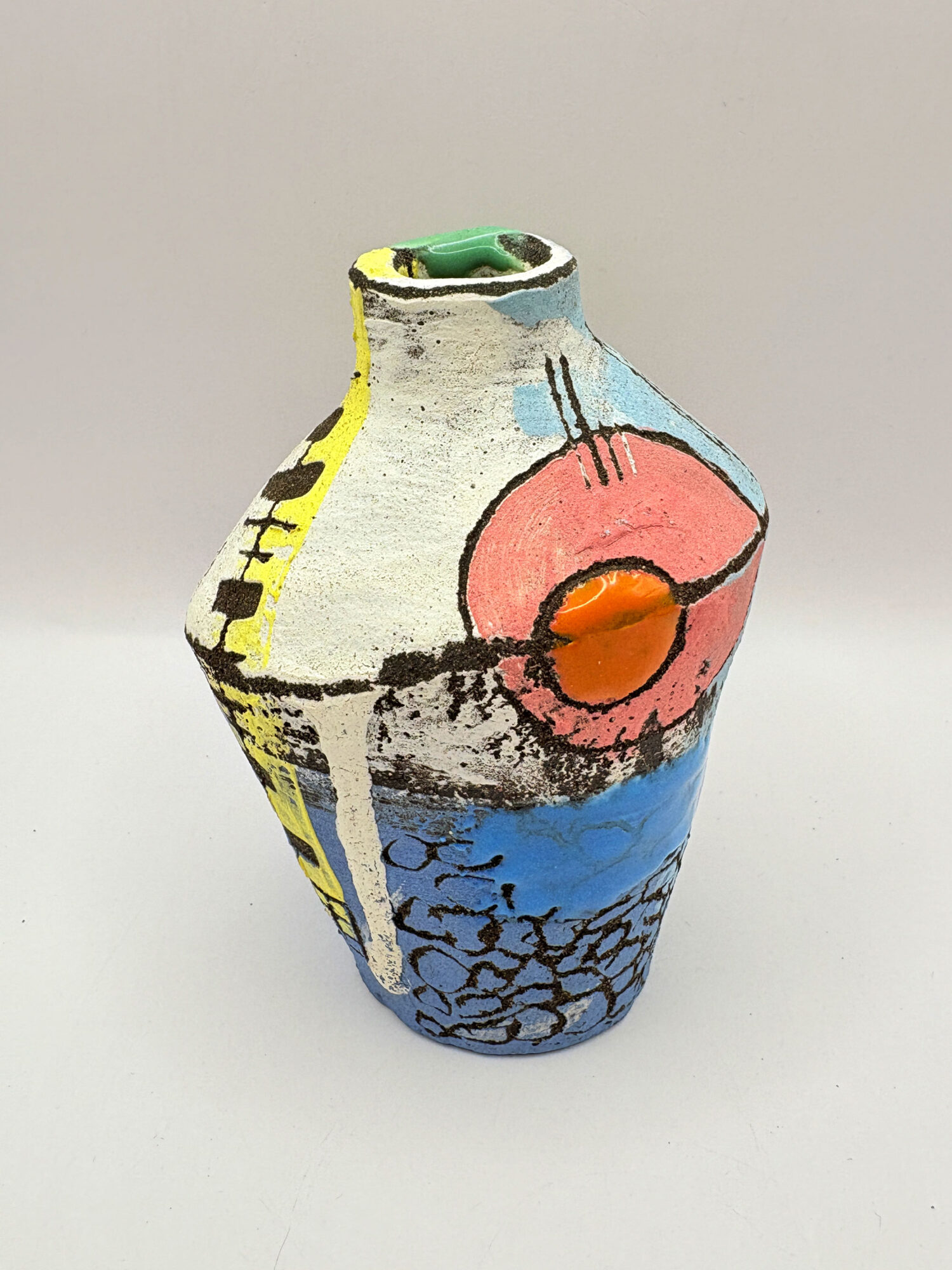 Small bottle with red circle