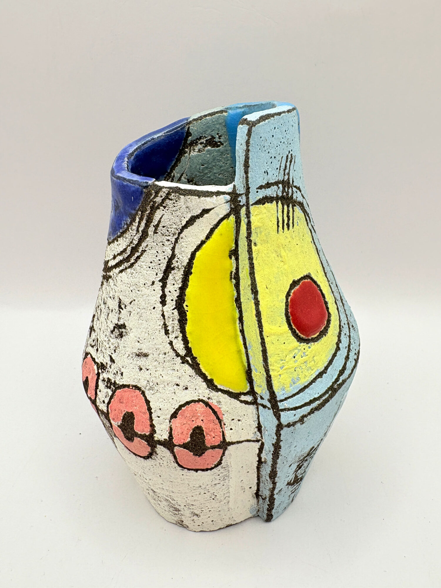 Small altered vessel with yellow sun