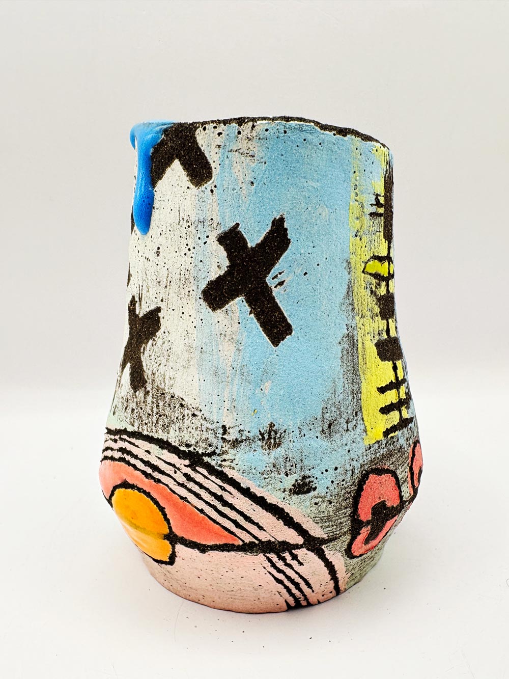small blue vessel with crosses